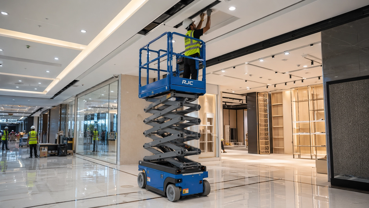Electric scissor lift used for ceiling and lighting works in a retail fit-out project